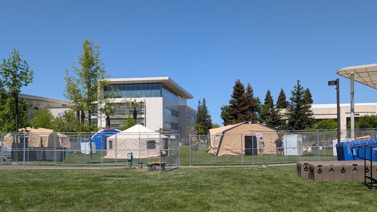 Modular emergency tents on a lawn at UC Davis Health